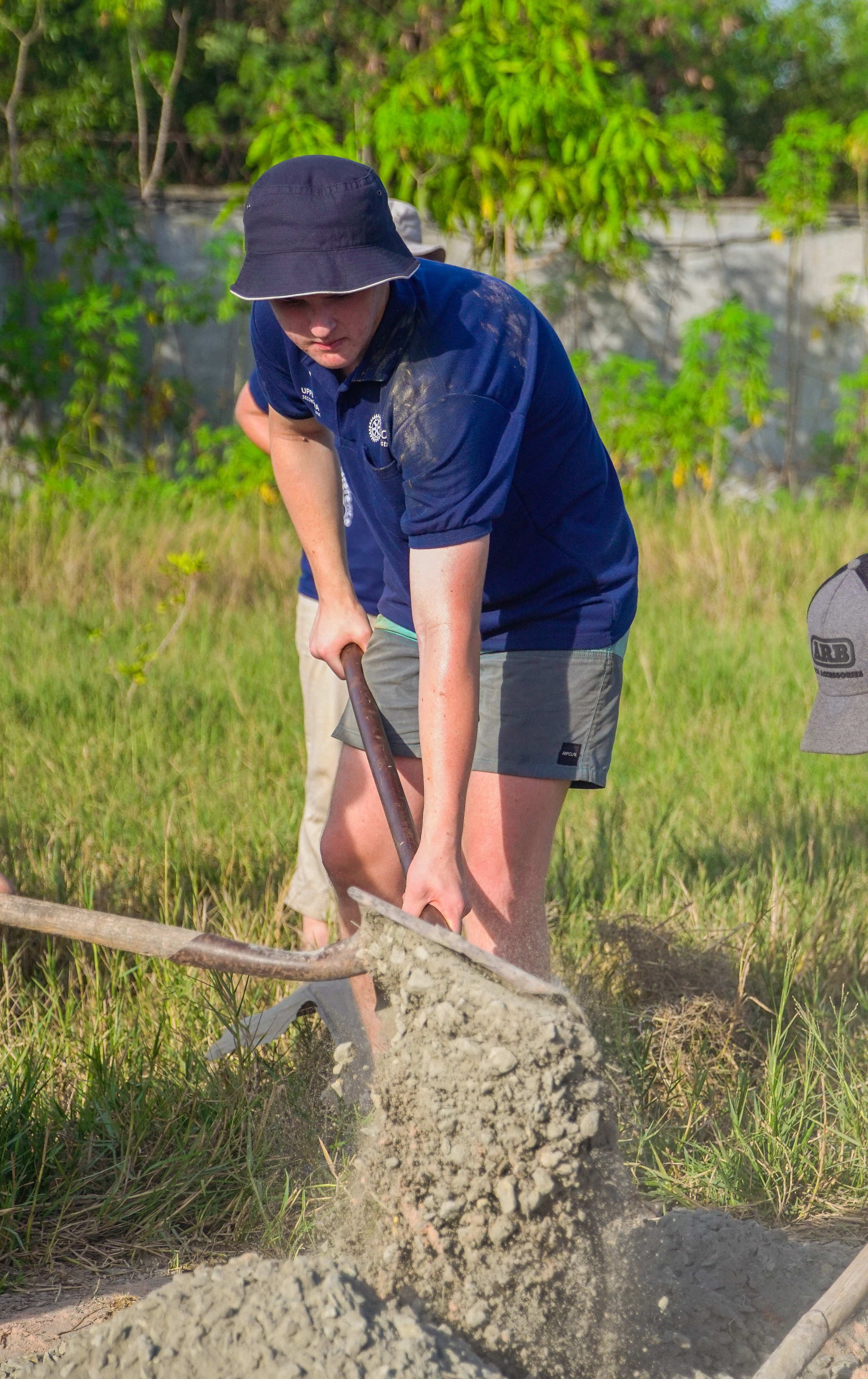 Mixing cement to build bio sand filters.