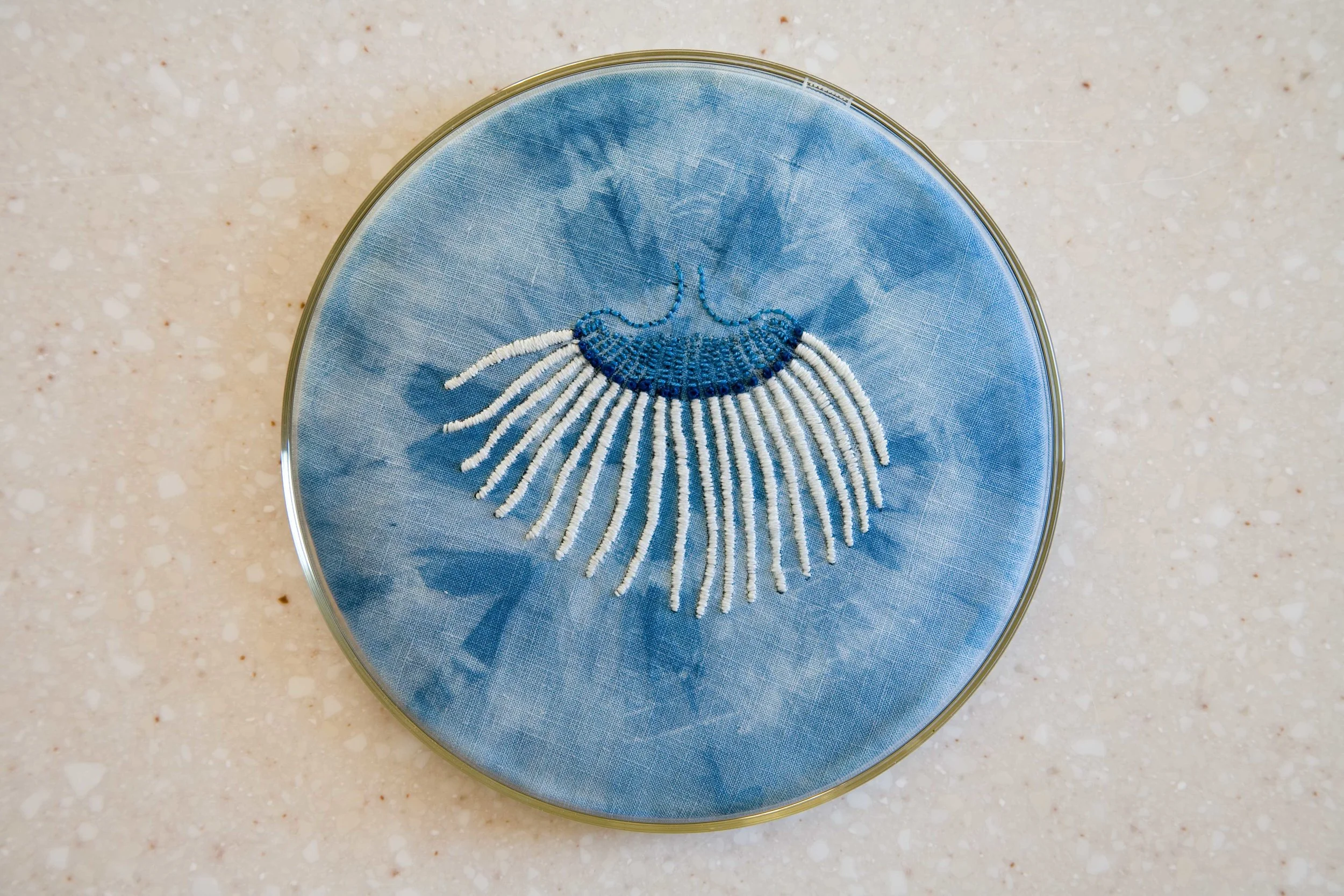Labouratoire , indigo tie-dye and cotton embroidery on cotton and linen, glass Petri dishes, table, 2007 Photo: Jeff Crawford
