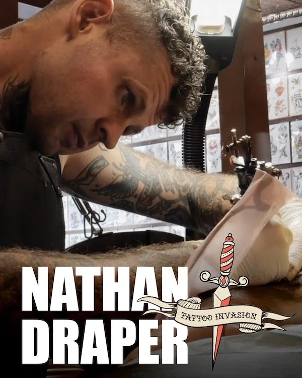 Tattooer Nathan Draper concentrates on tattooing a client in his shop in Bowmanville, Ontario, Canada.
