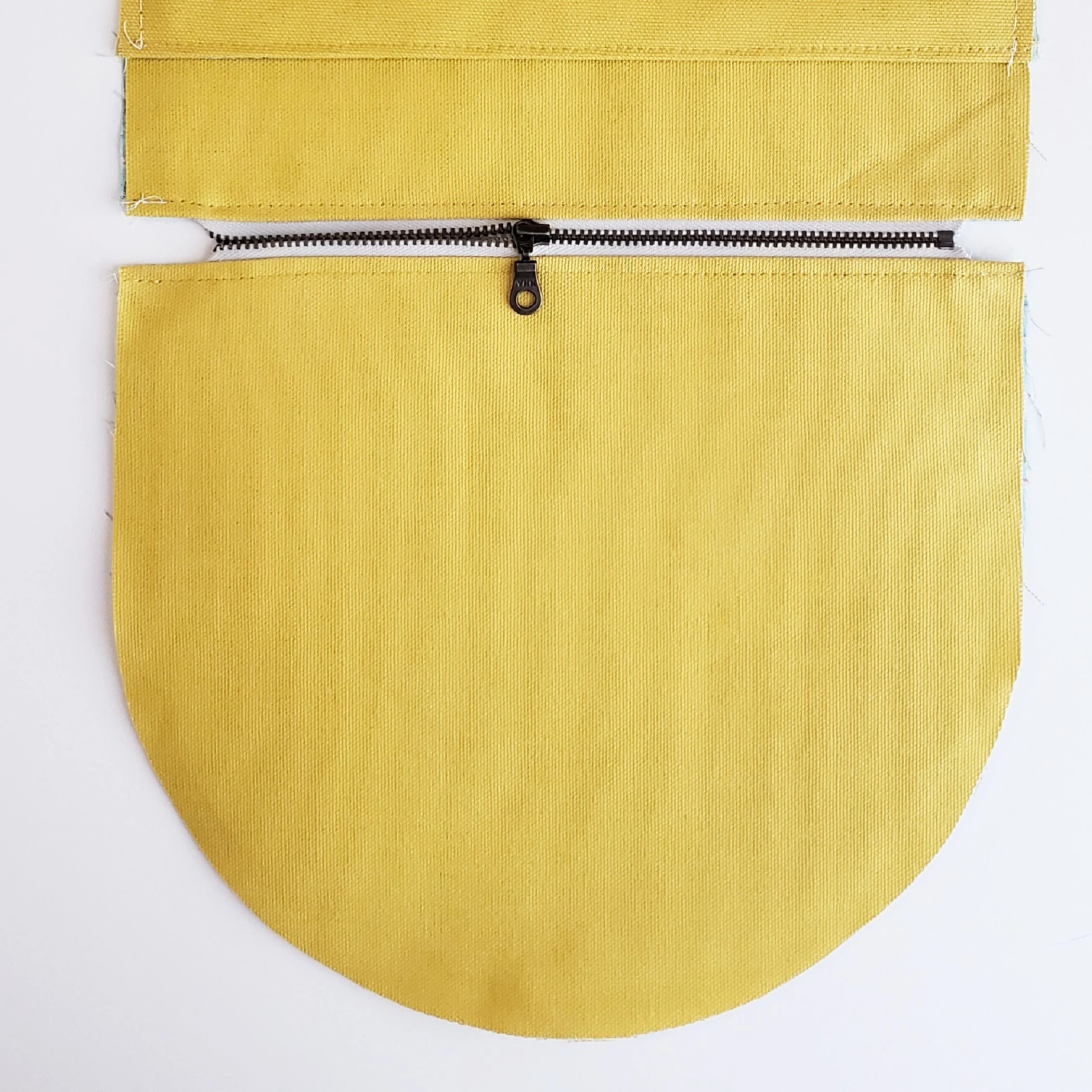 6. Press Main Body and Lining away from zipper and topstitch top edge.