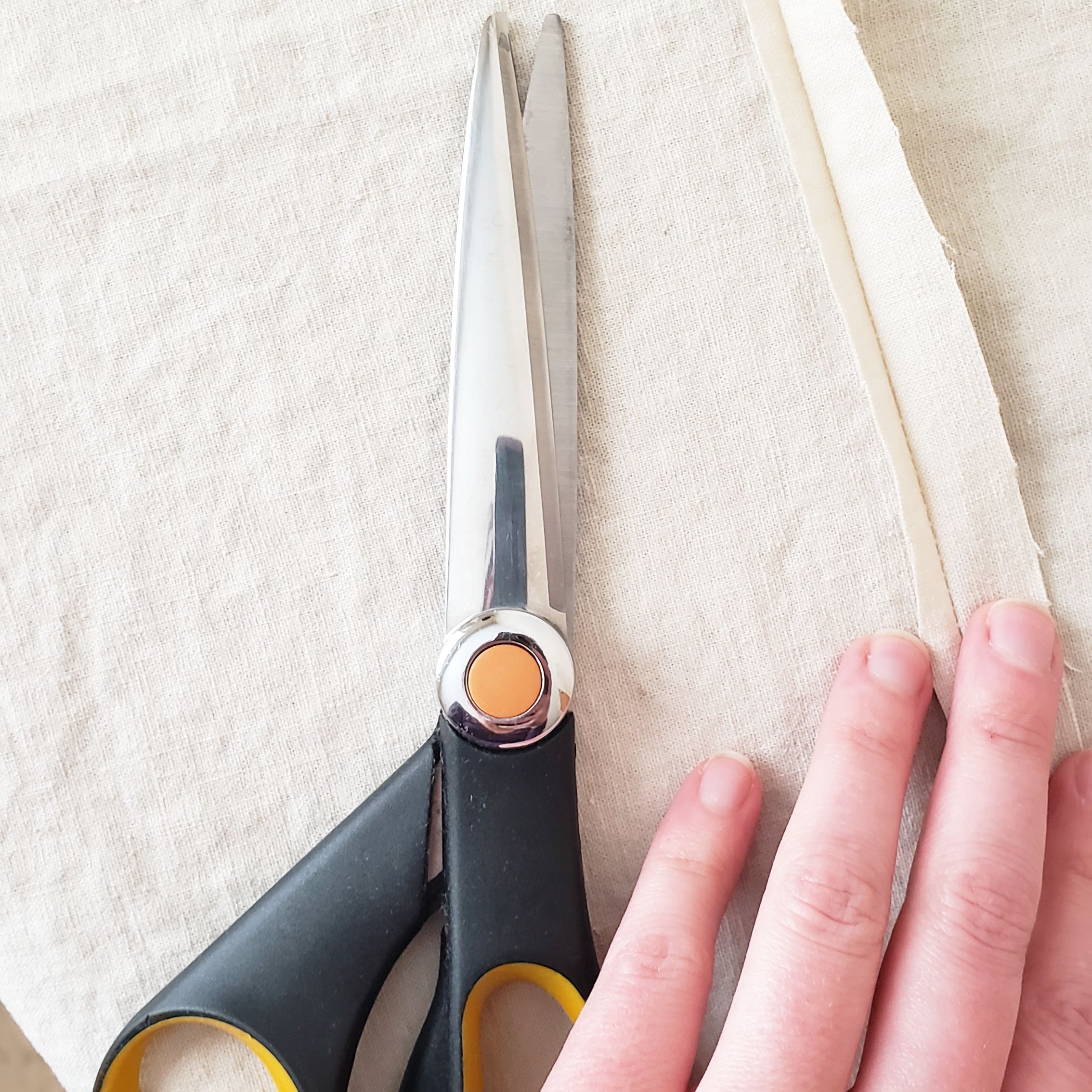 1. After sewing each seam, trim one side of the raw edge down to approx. 3/16”