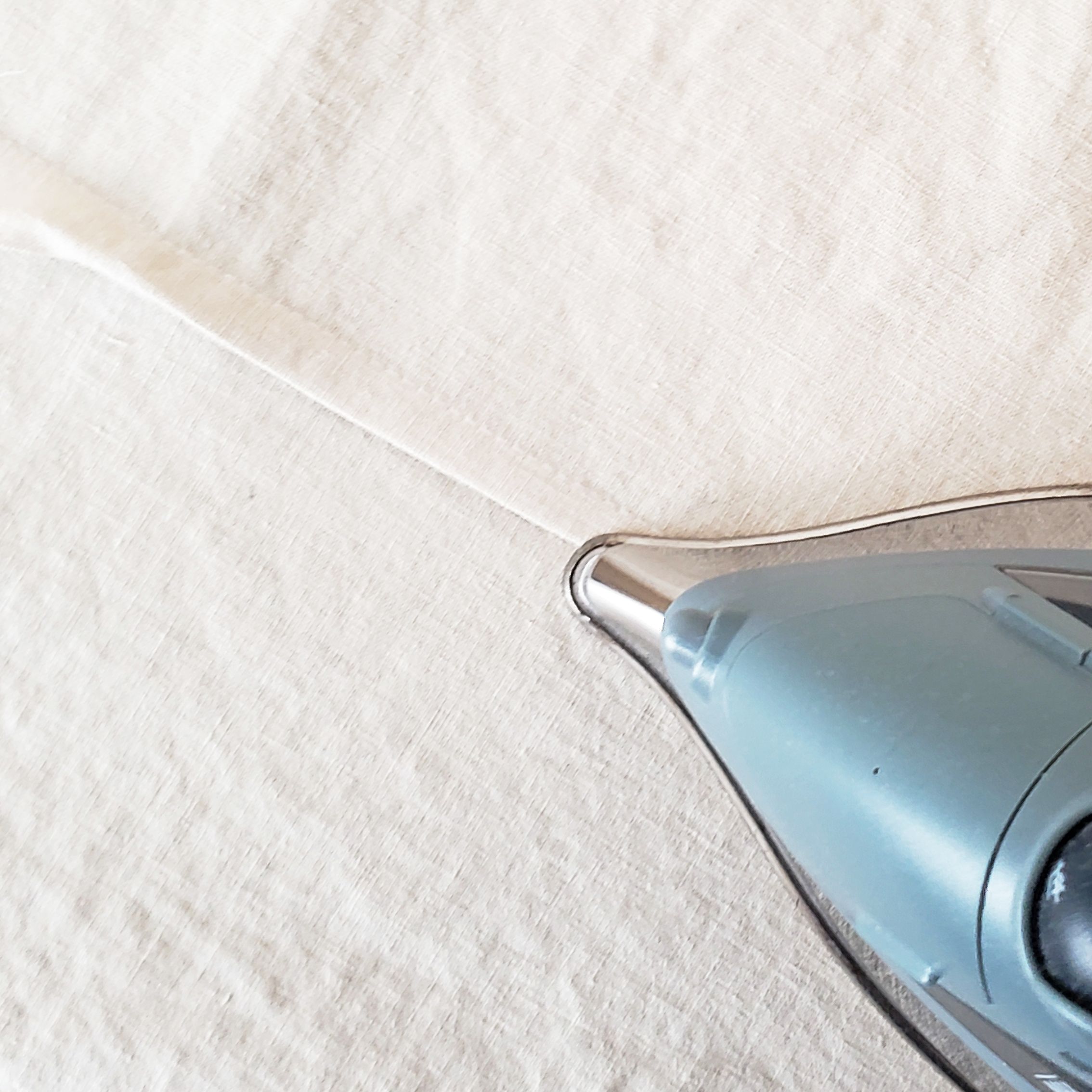 4. Press the fold down to keep it in place (you may need to pin tricky seams that won’t stay down)