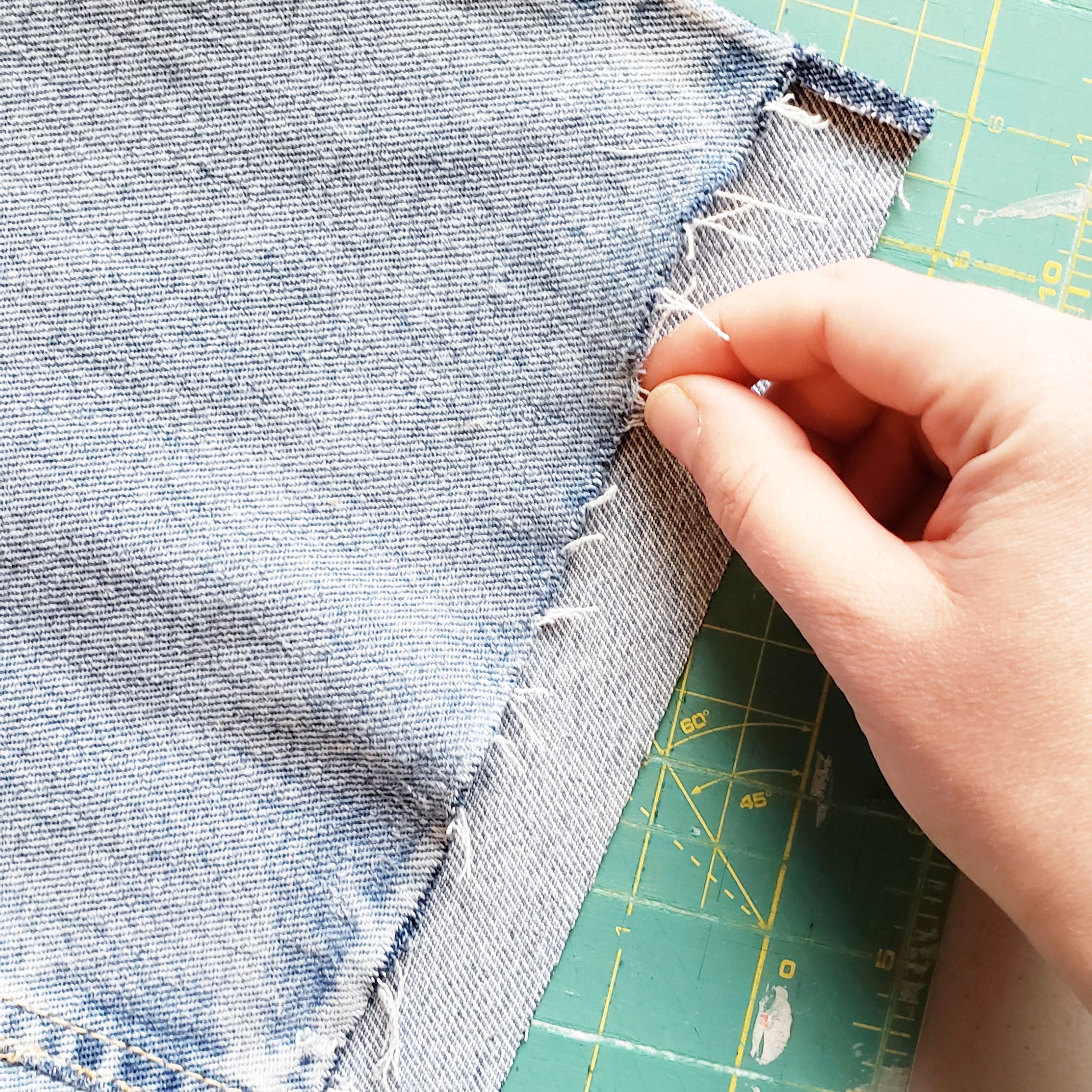 Pulled the strings to encourage fraying…