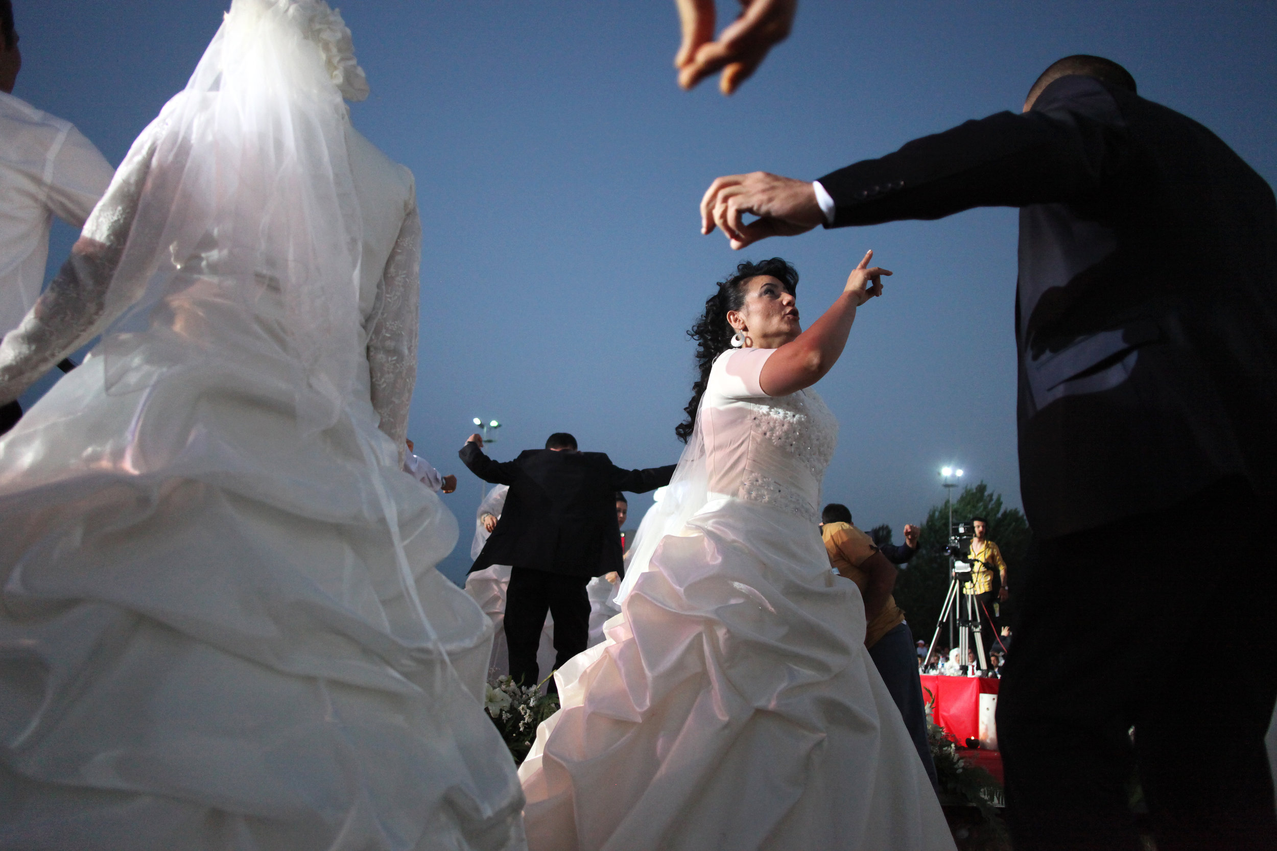  Couples dance during a wedding festival which the Ankara Buyuksehir Municipality organizes annually to help low-income families on June 29, 2013 in Ankara, Turkey. This year 213 couples participated in this community wedding.     