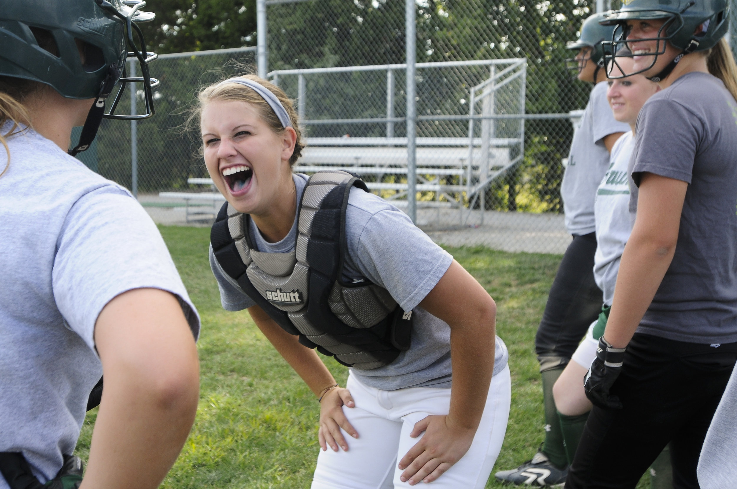  Rock Bridge softball player Samantha Bell&nbsp;jokes with her teammates in Columbia, MO. 