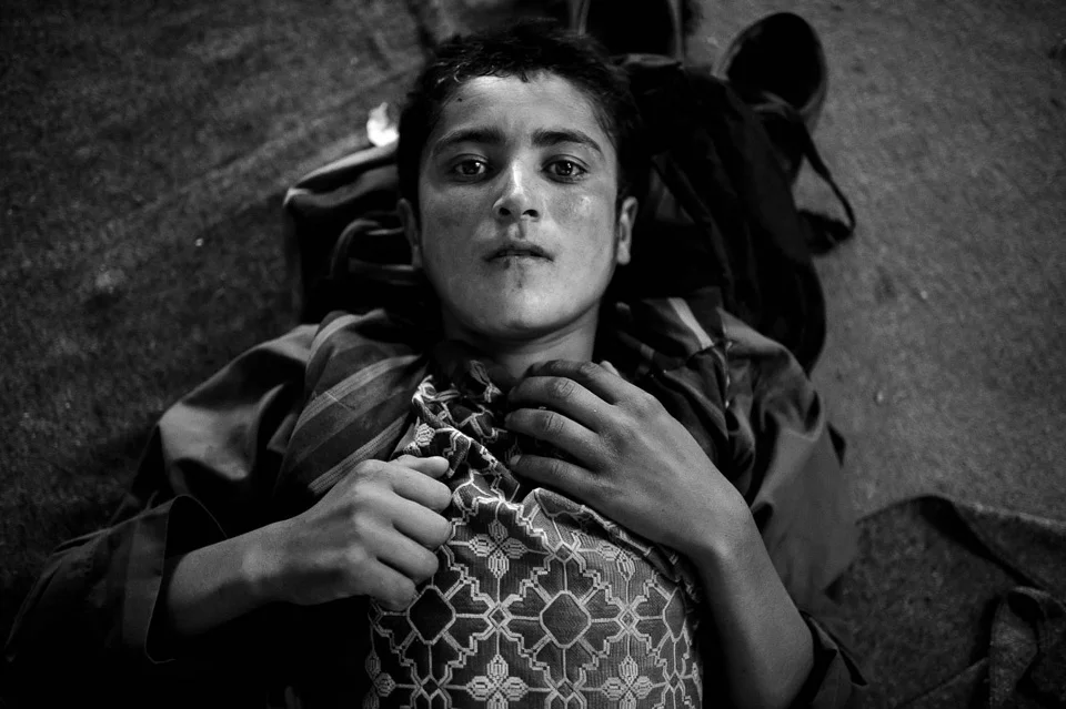 Mohammad Asef, 17, from Mazar Sharif, Afghanistan. Refugees detained by Iranian border police are held in a camp lacking proper hygiene. There is not enough food and clean water. Iranian police are fighting against human trafficking although there are accusations that they also assist smugglers. August 2017.