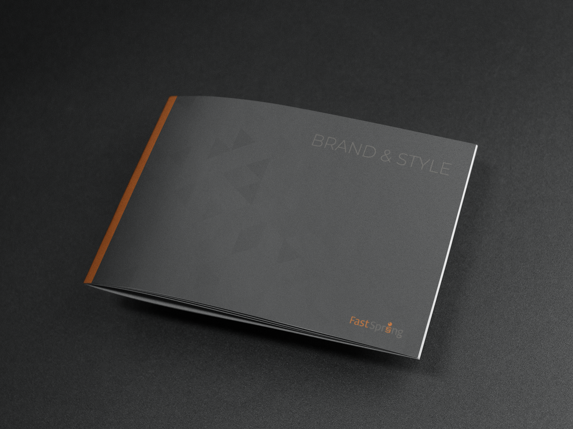 closed-booklet-on-a-black-surface-mockup-a14585.png