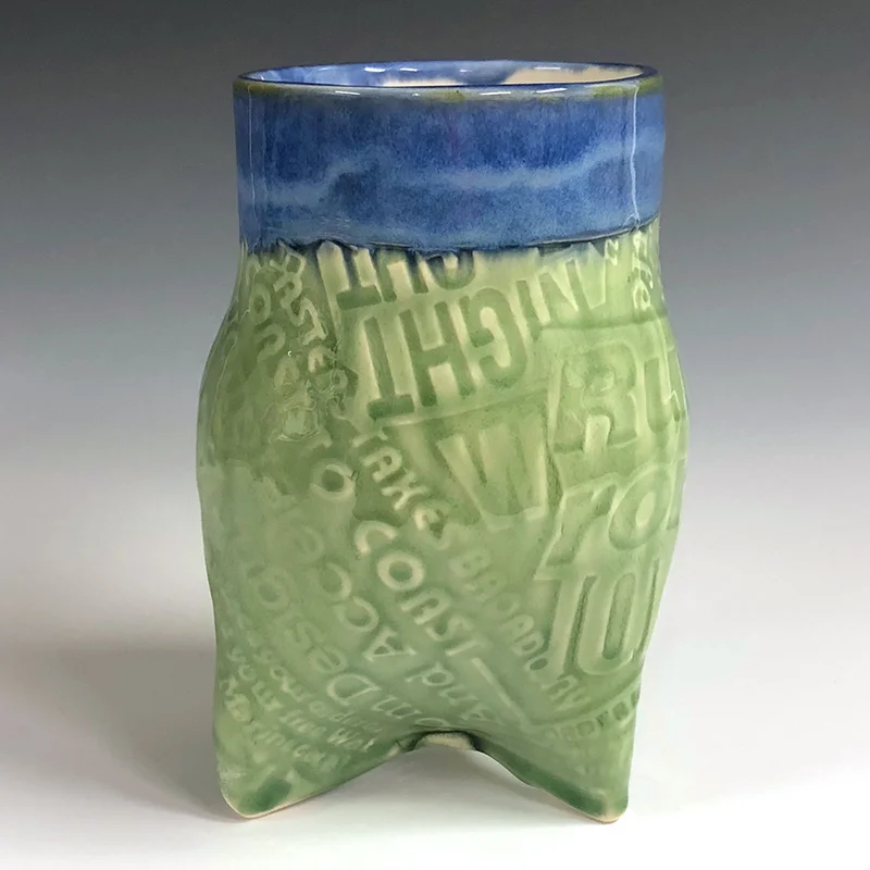 Tri-pod vase with a lot to say