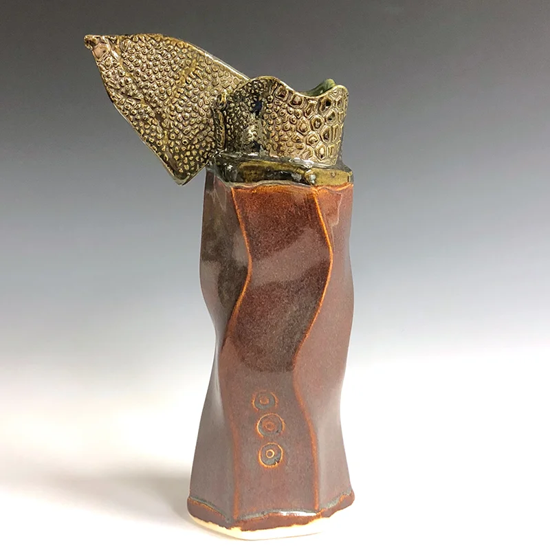 Winged vase with a spunky attitude