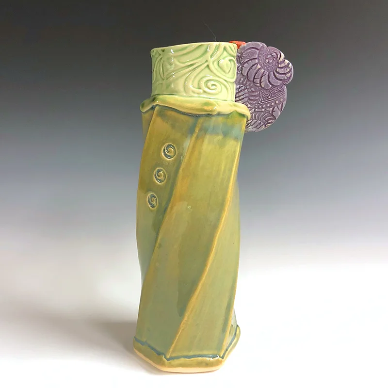 Spunky green vase with purple wing