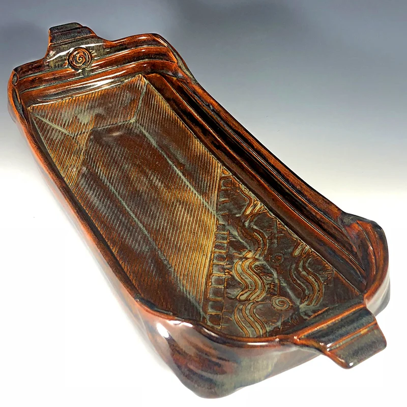 Luscious jasper, blue and golden browns accent the texture on this footed platter