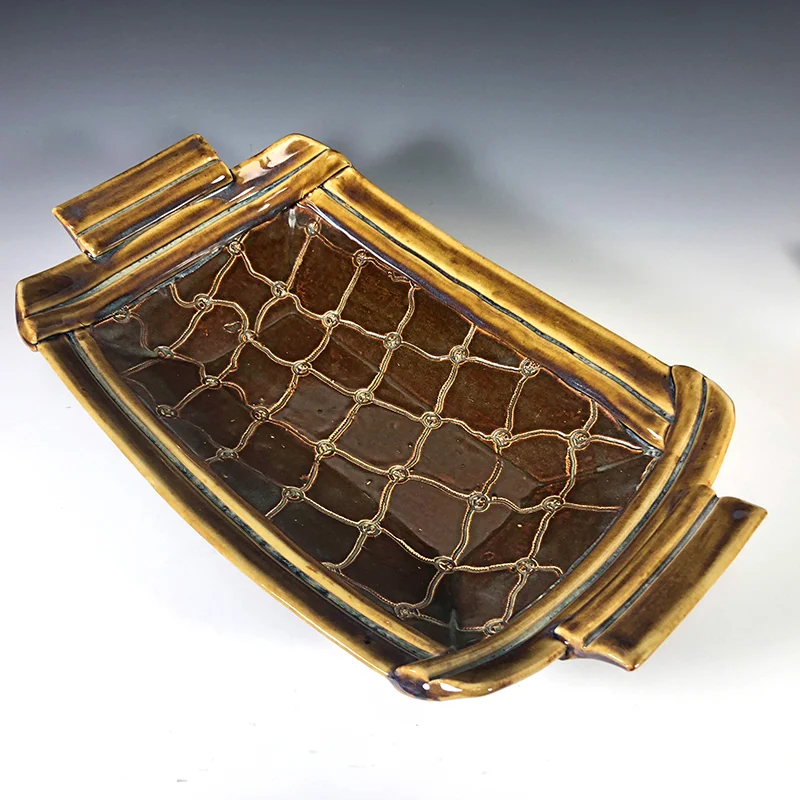 You'll be a trendsetter when you use this handmade ceramic platter 