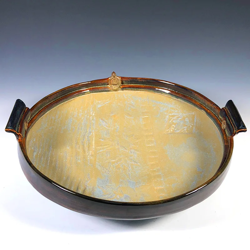 Rich golden textures, rimmed by jasper browns make this a showpiece 