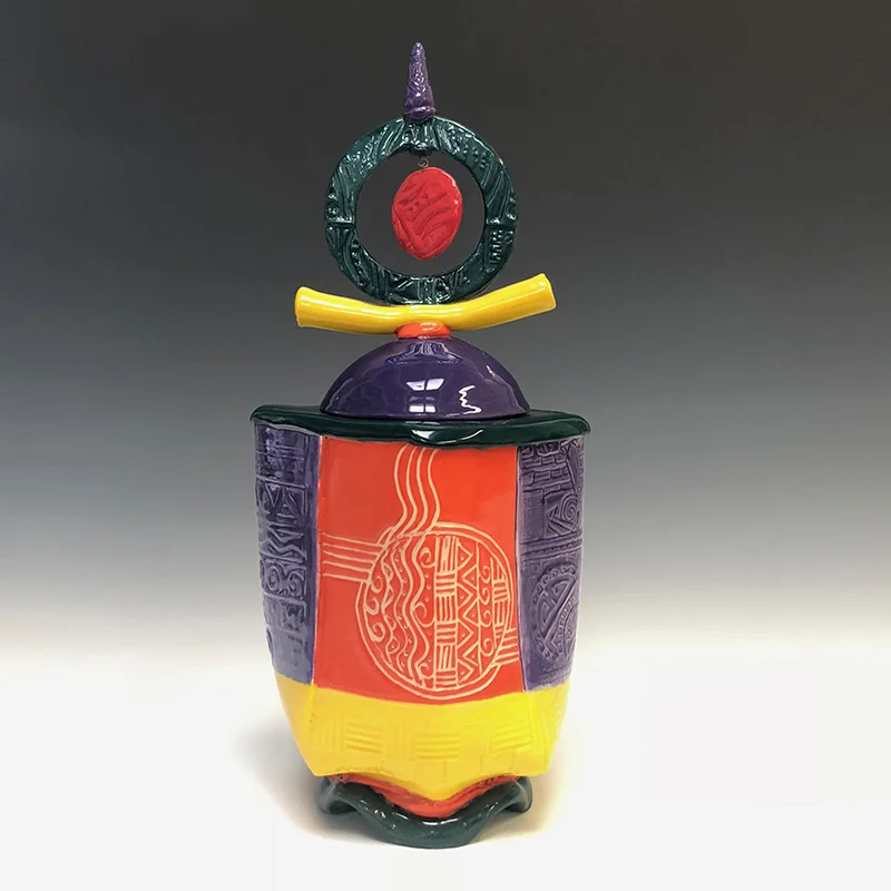 Brightly colored, carved treasure container with a surprise