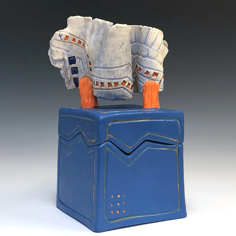 Organic form tops this container