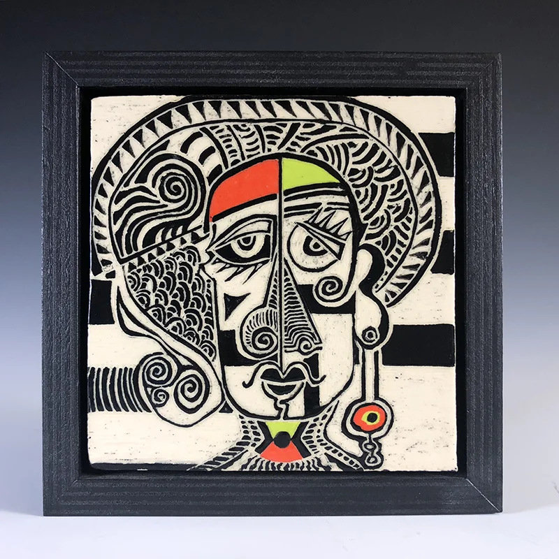 This framed wall art features a Tribal-Picasso, fun look.