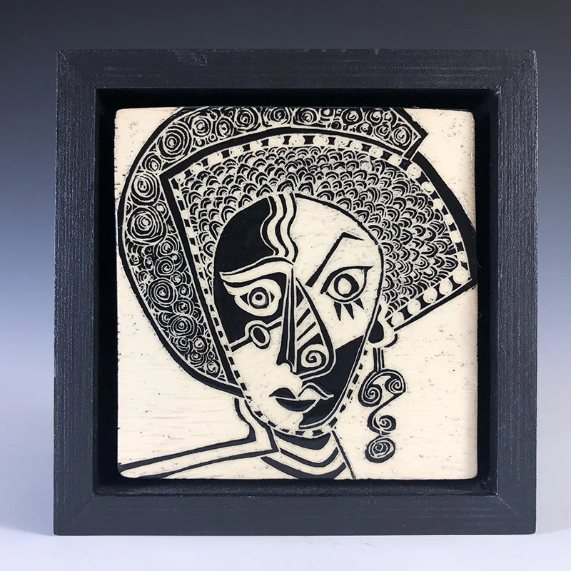 Framed tile in a Tribal-Picasso style, with a great earring!