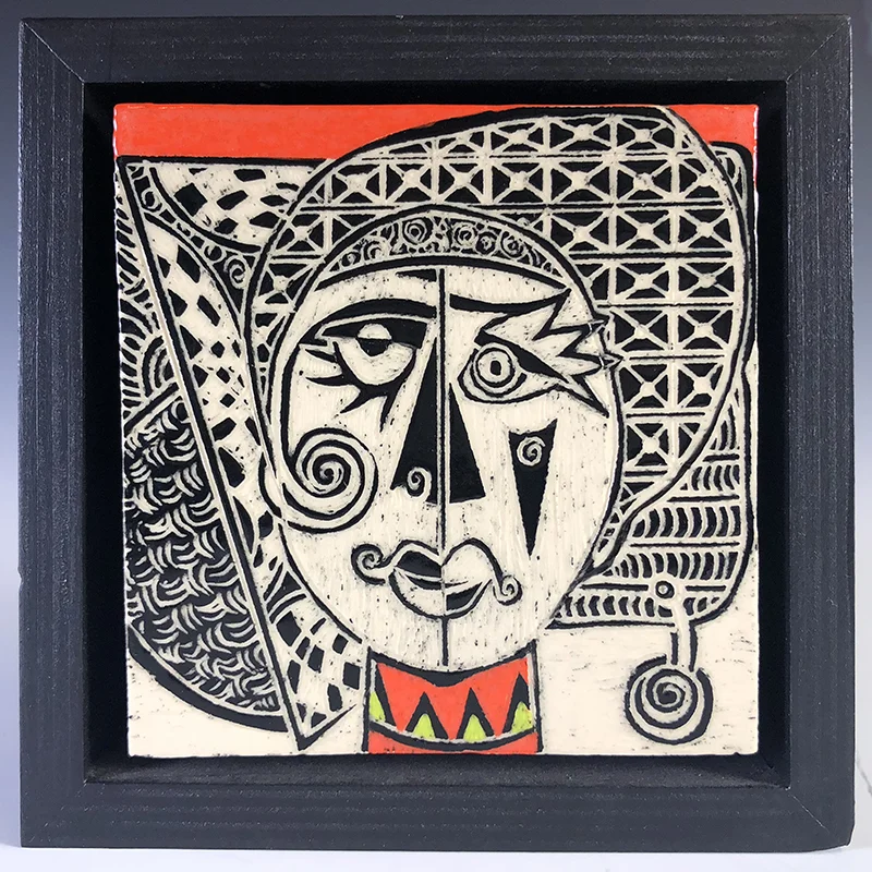 Tribal-Picasso-like carved tile, with a great earring 