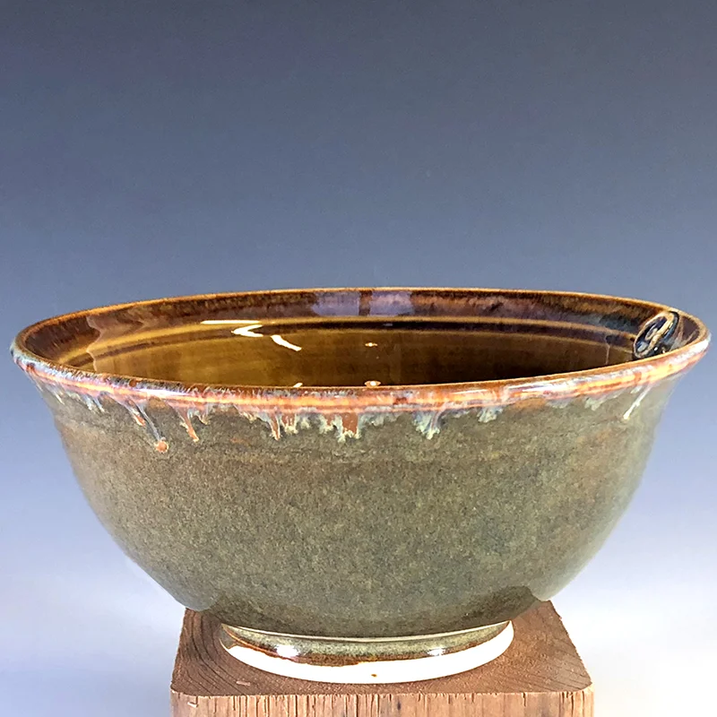 Iron luster bowl with a rainbow on the interior