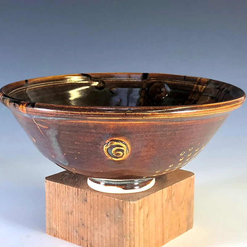 Rich golden brown bowl with a warm combination of interior colors