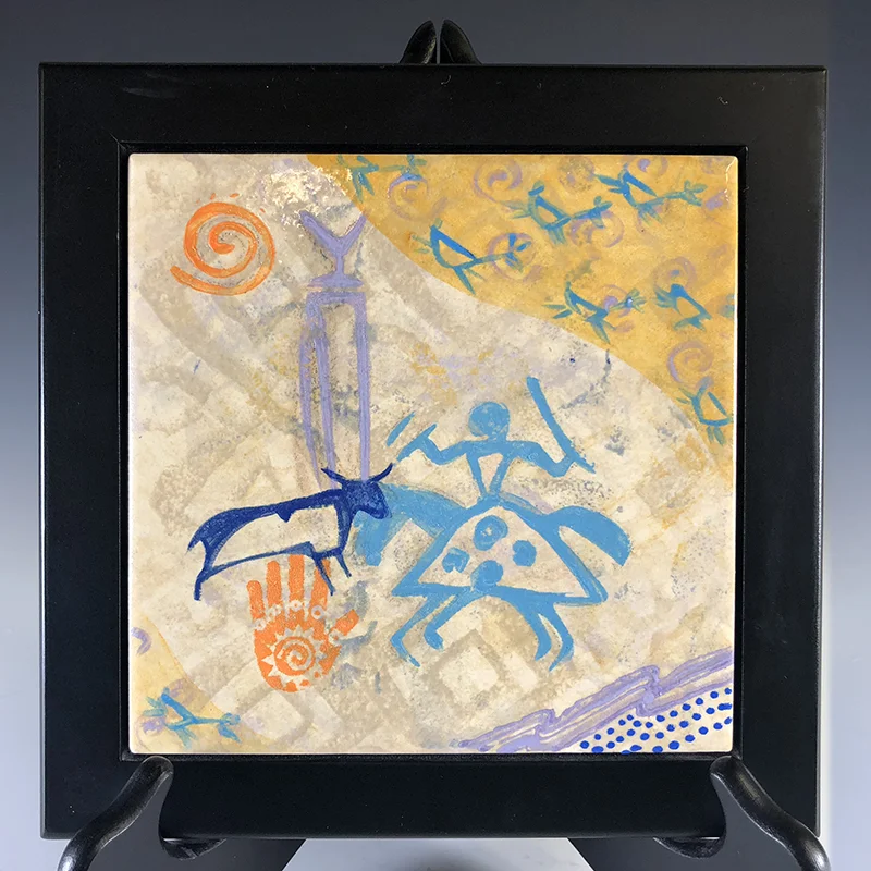 Intriguing petroglyphs symbols adorn this wall art or trivet