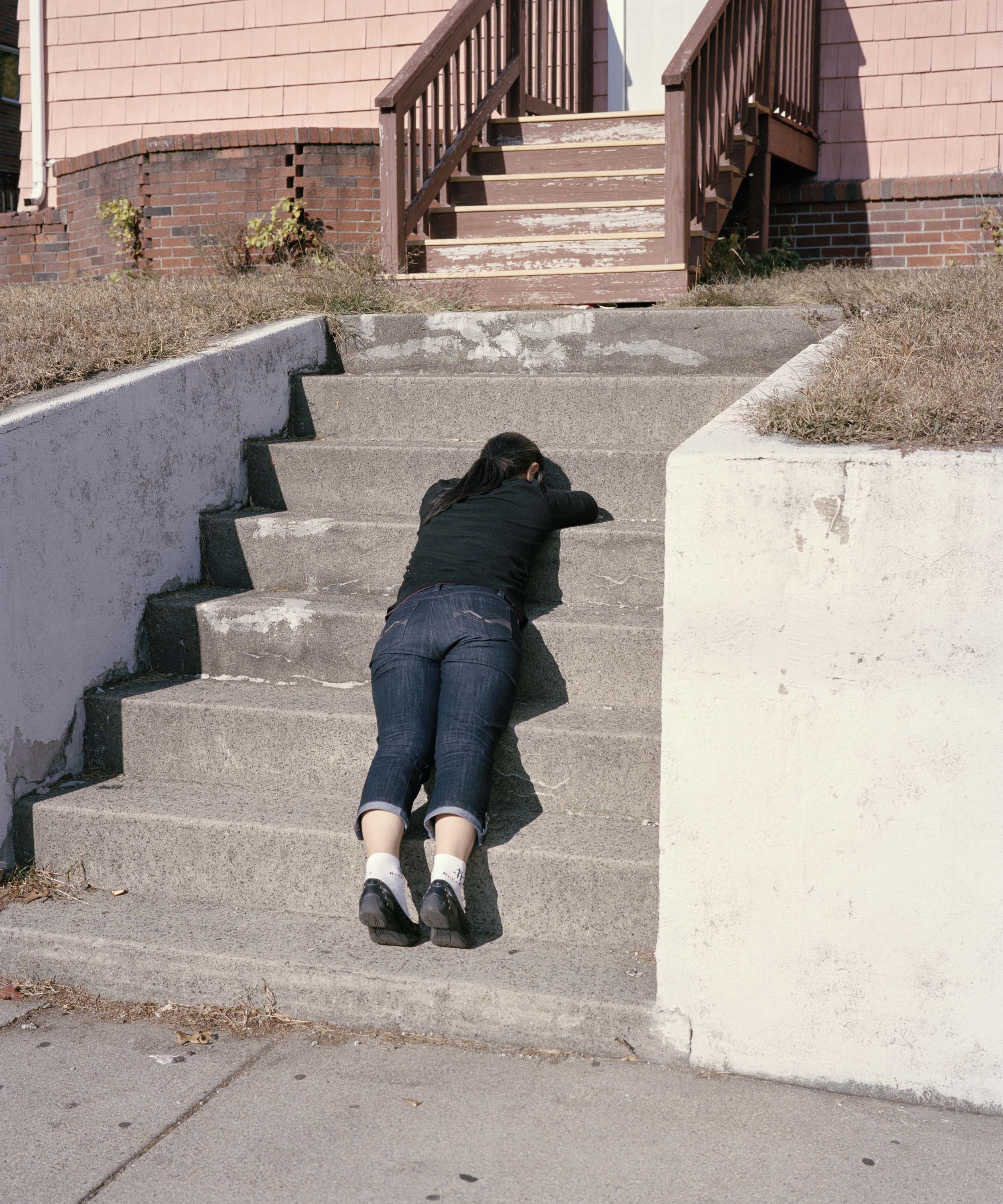  Woman Laying on Stairs, near Boston, MA, 2013 