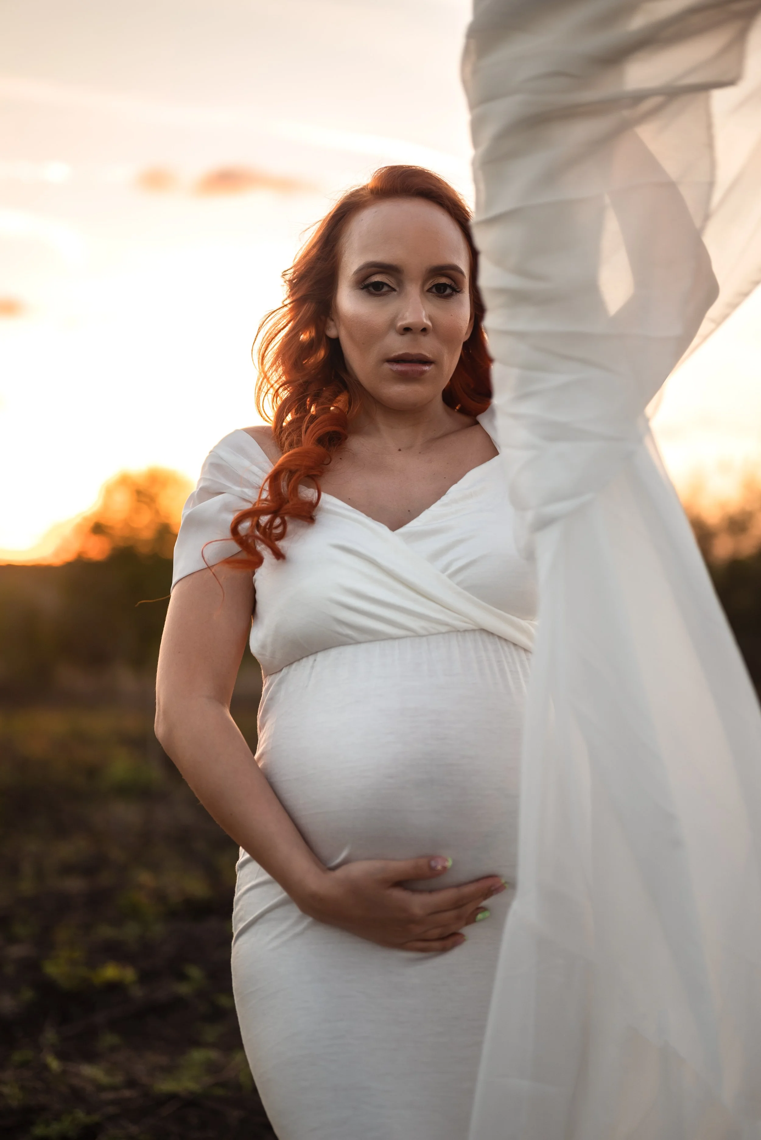 pregnant-woman-white-fabric-movement-artistic-maternity-photography.jpg
