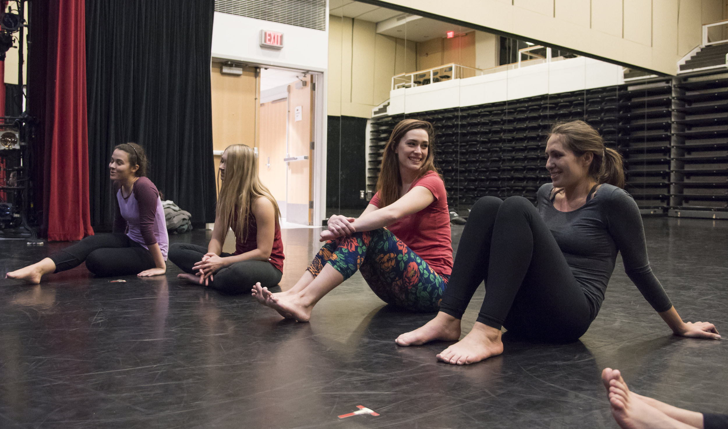  Sarah Tuberty talks to her friend Katie Rich after the warm-up at the start of the weekly aerial dance class she takes at Boston University’s Fitness and Recreation Center. Tuberty chose to take aerial silks because of their flexible and more forgiv