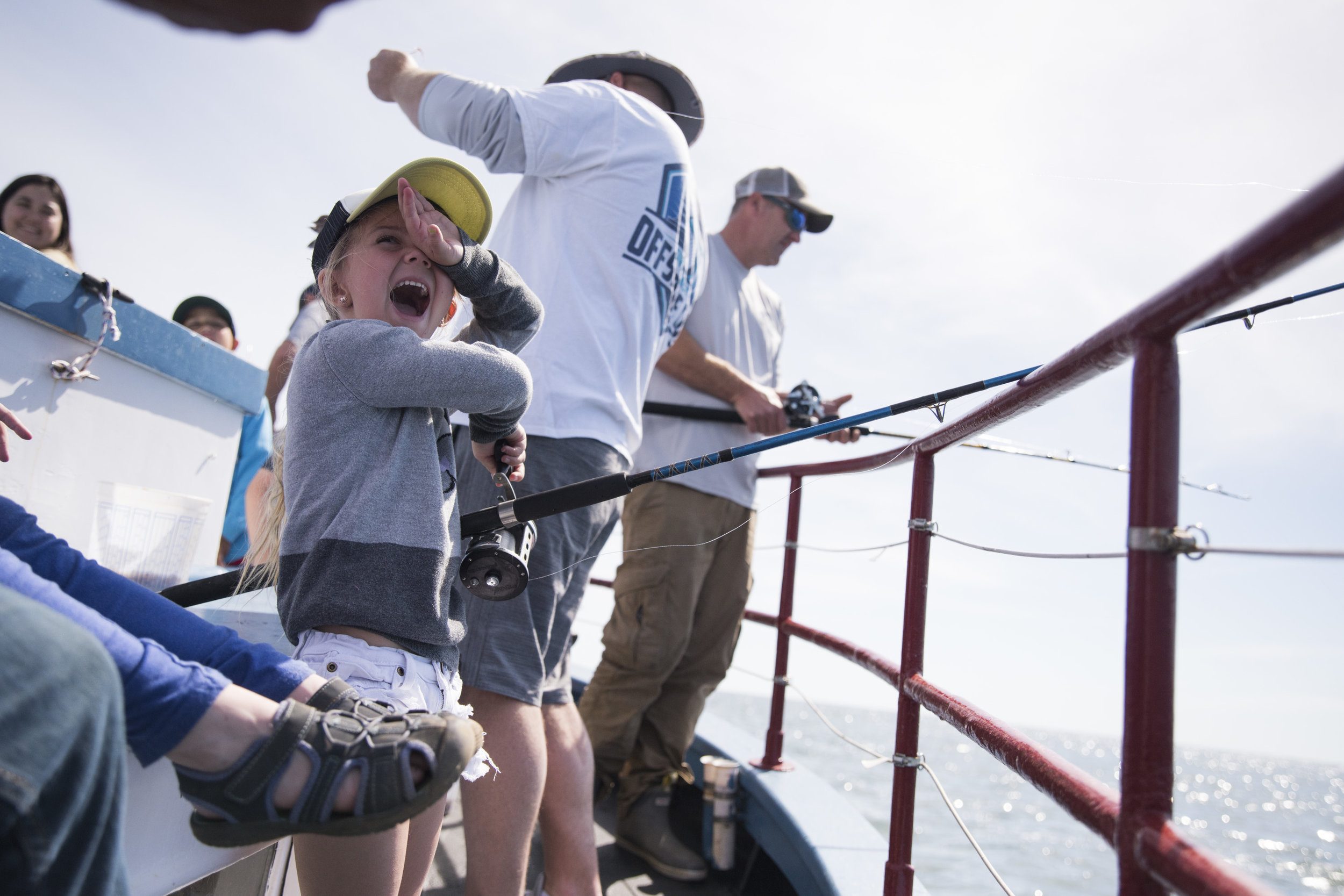  Willow Rosbeck, 5, turns with excitement as her dad unhooks fish she caught aboard the Skipper. Students from the Rainbow Place preschool in Edgartown, MA were treated to a free fishing trip to celebrate their graduation, curtesy of Skipper captain 