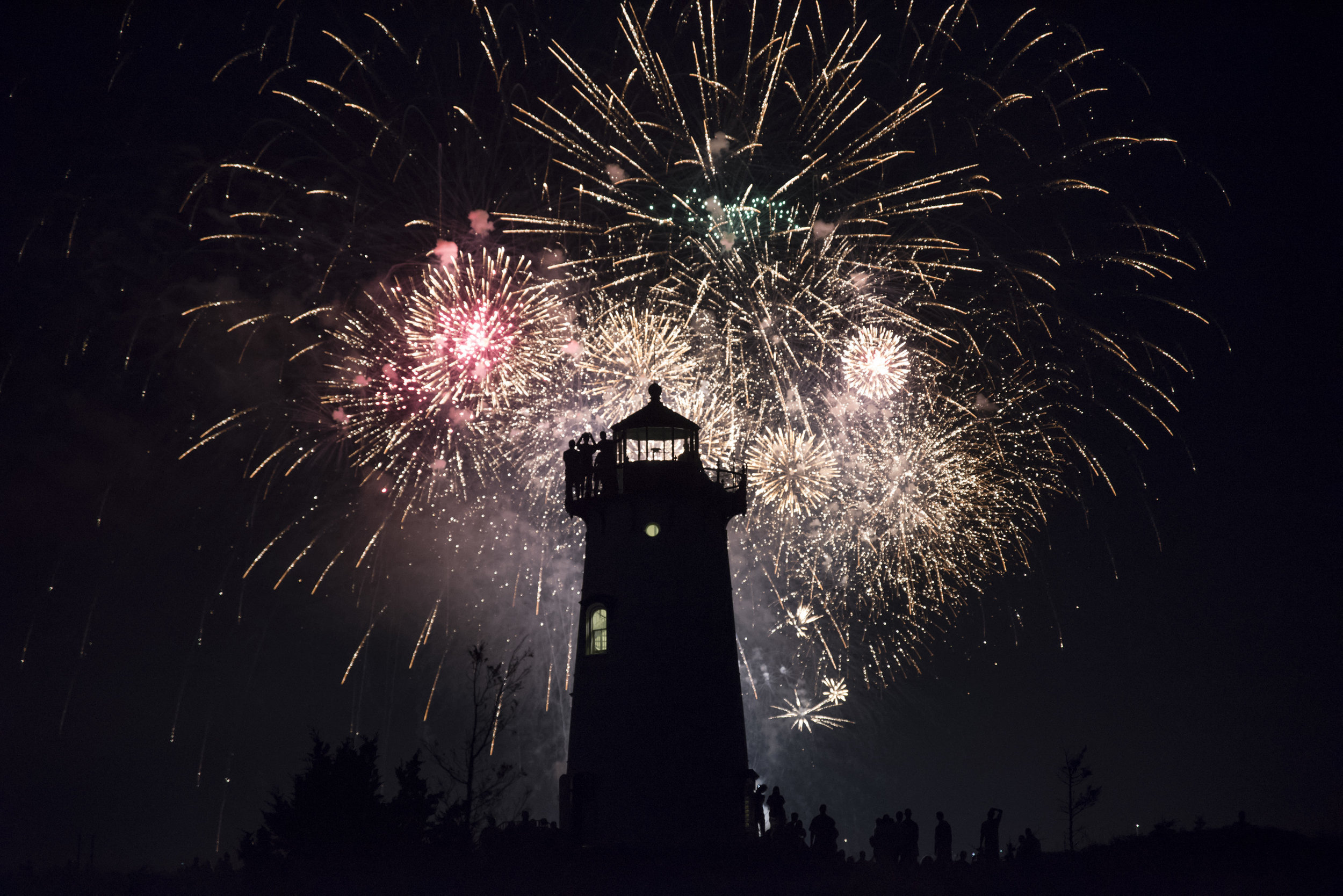  Fireworks explode behind the Edgartown Light House in Edgartown, Massachusetts.  
