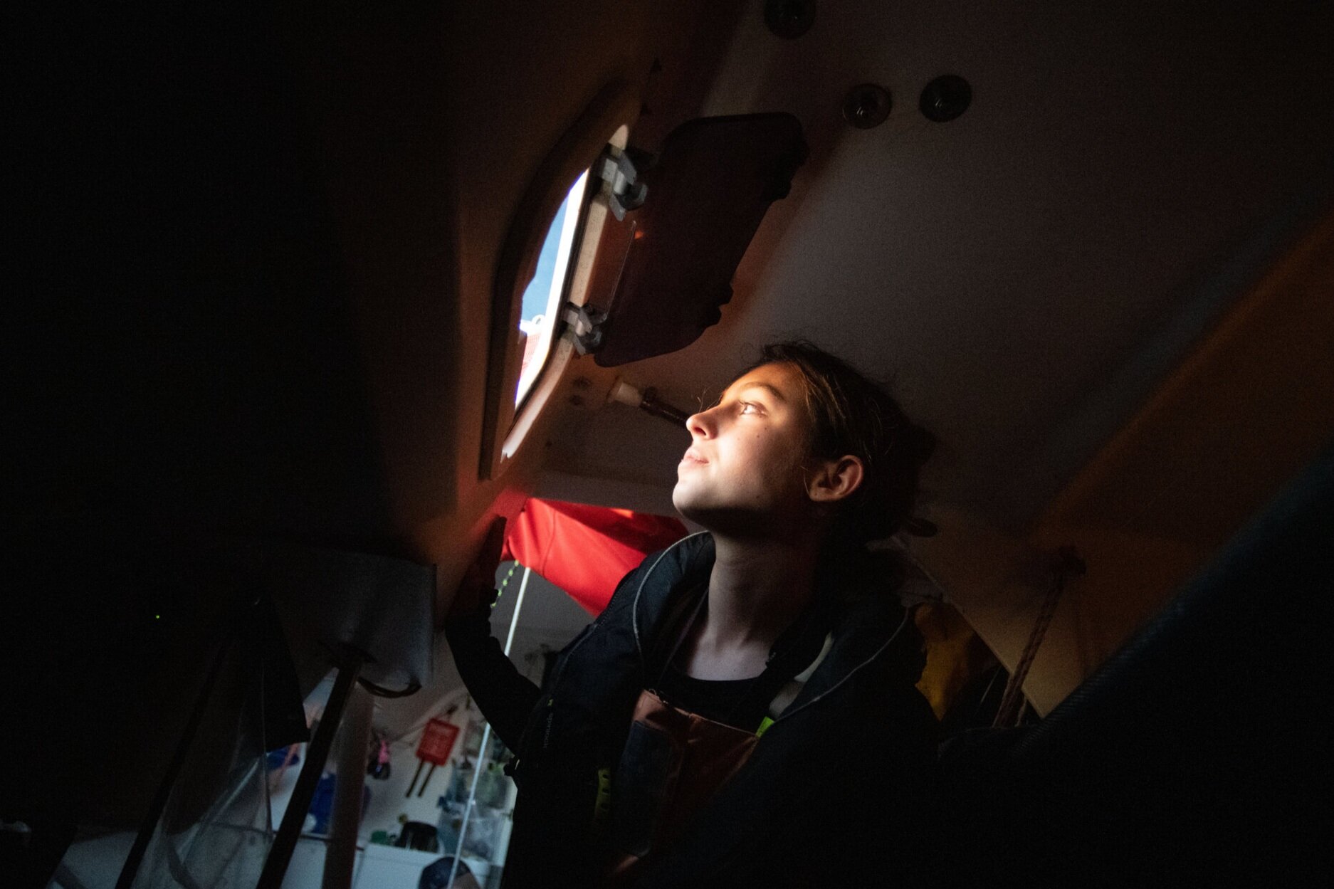  Oakcliff trainee Anna Sems looks out the hatch window during the Annapolis to Newport Race.  