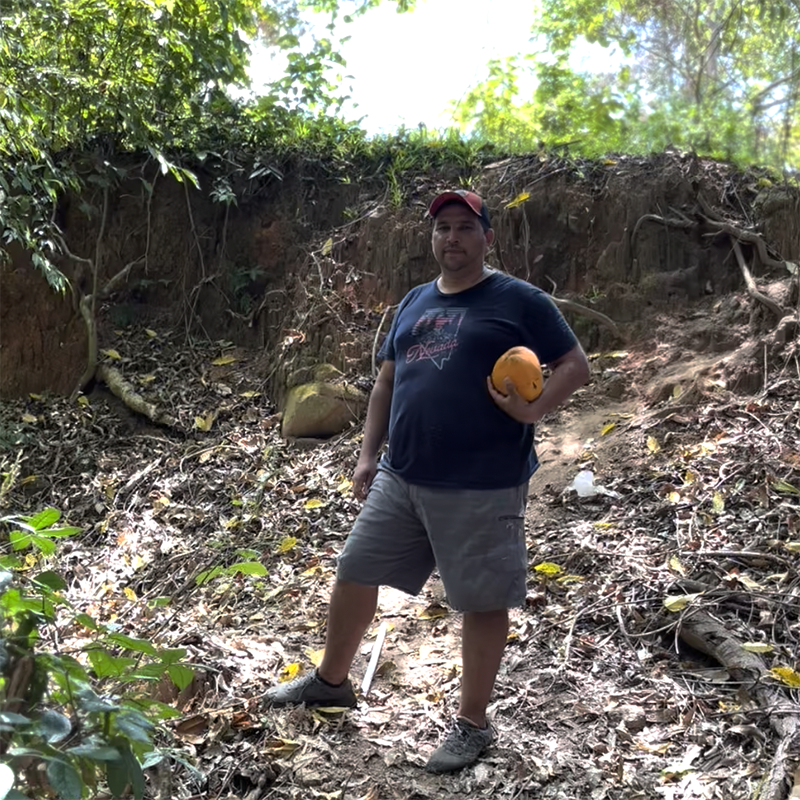 Carlos shows Josh the ravine where RN will help build a bridge to better connect the village to the Arabu Community Center