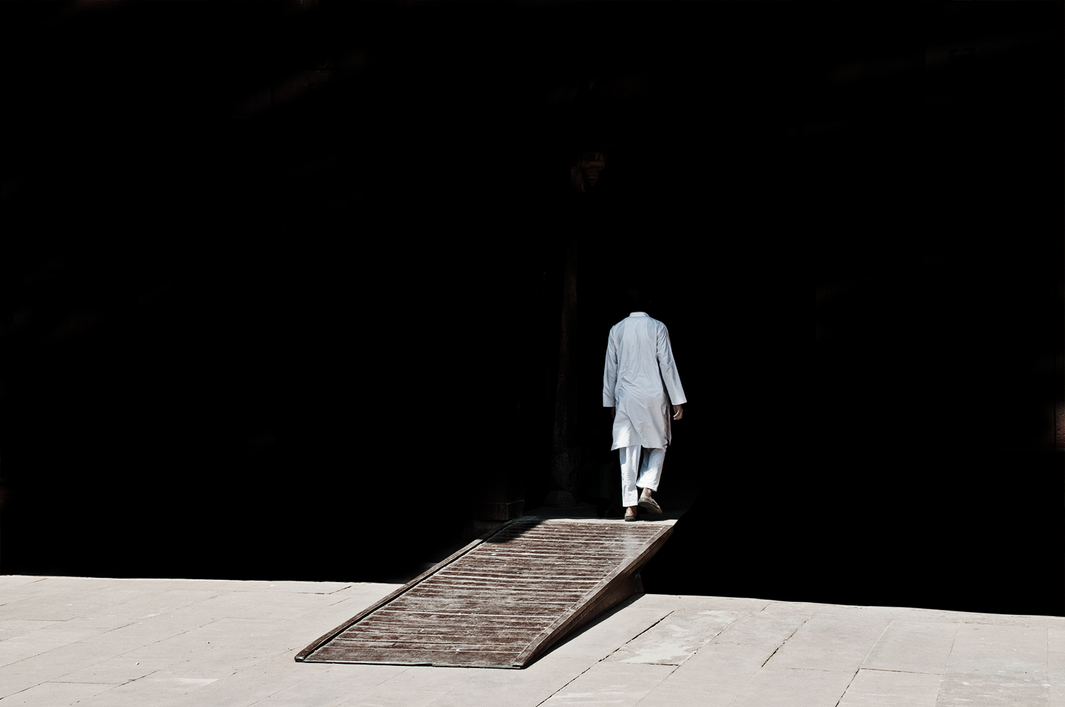 man walking through door.png