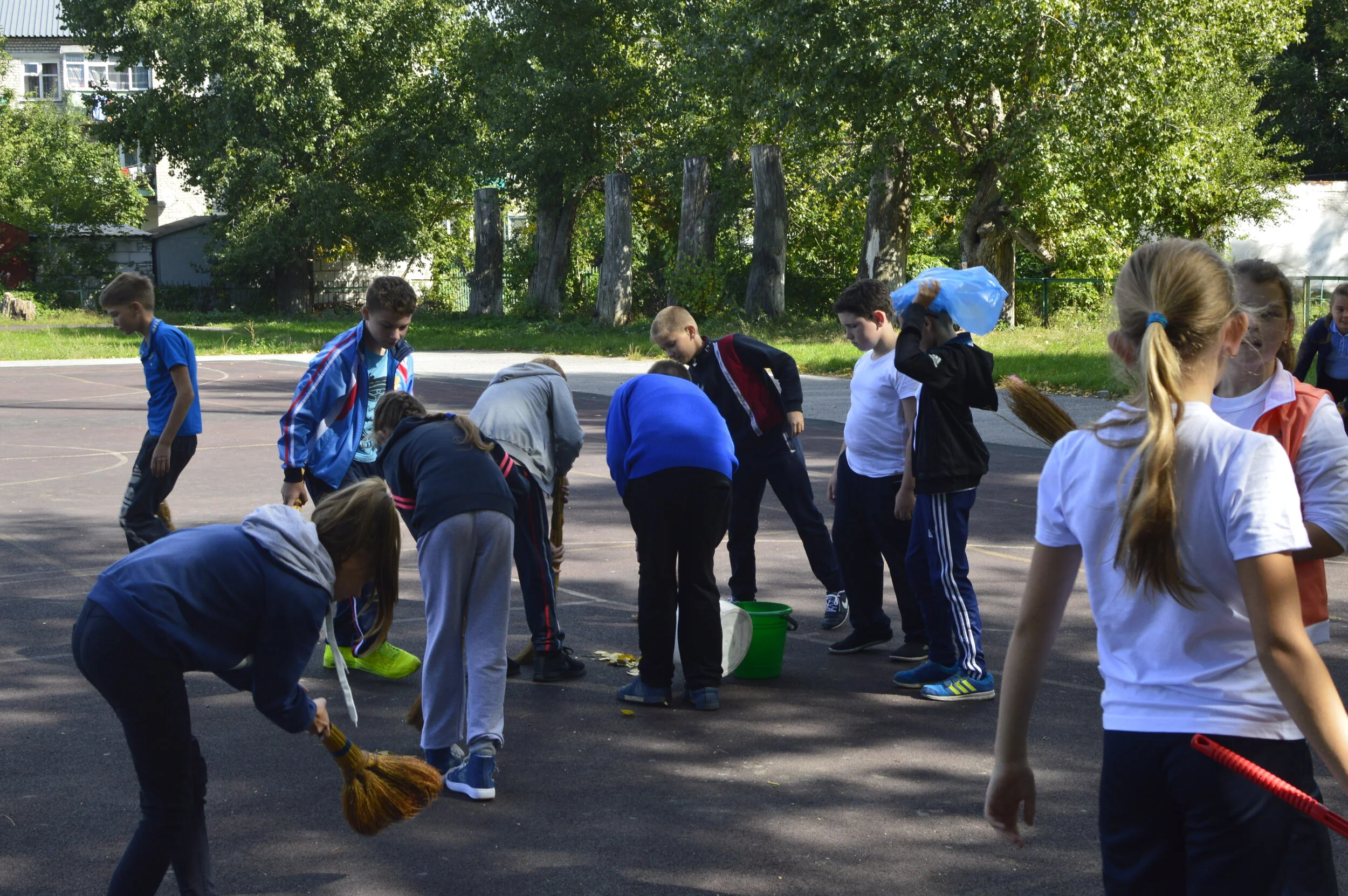 Cleaning the school yard — LifeLink Friendship Schools