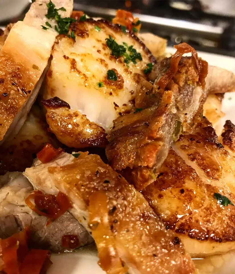 House pickled fried pork belly with pan seared dry pack scallops over red grits