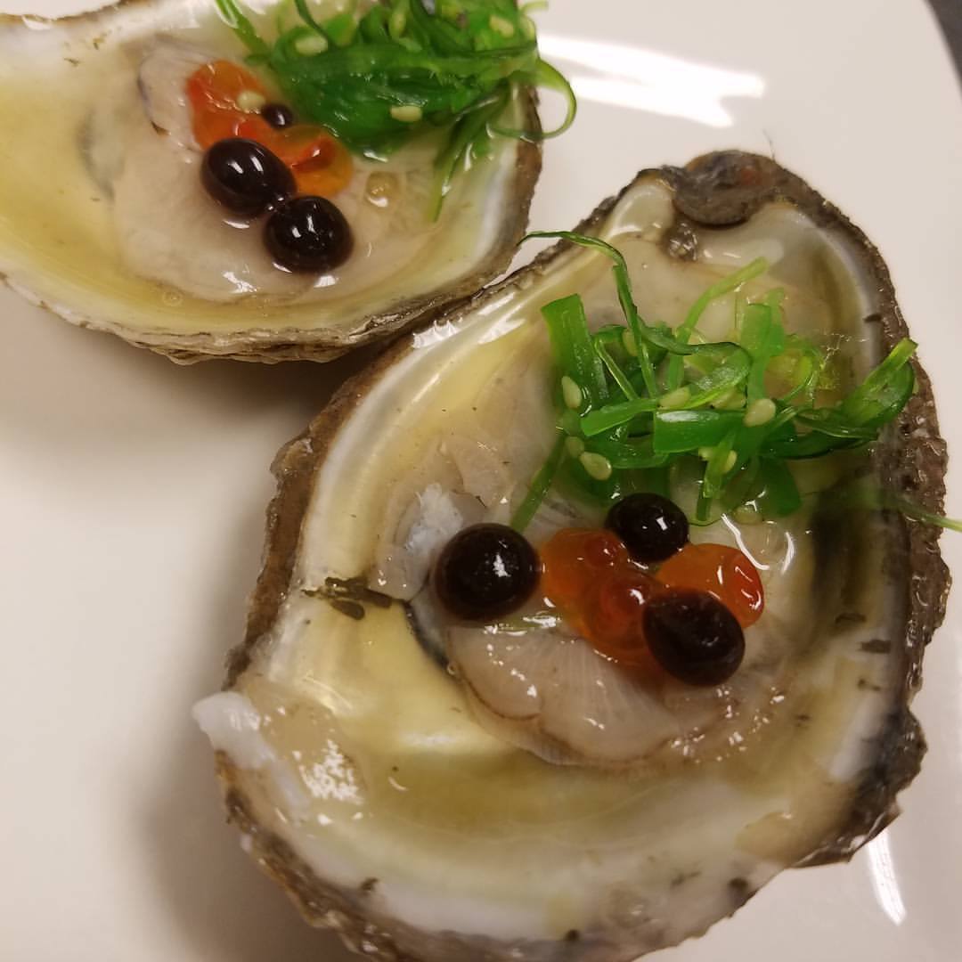 Lightly pickled oysters with salmon eggs and balsamic caviar