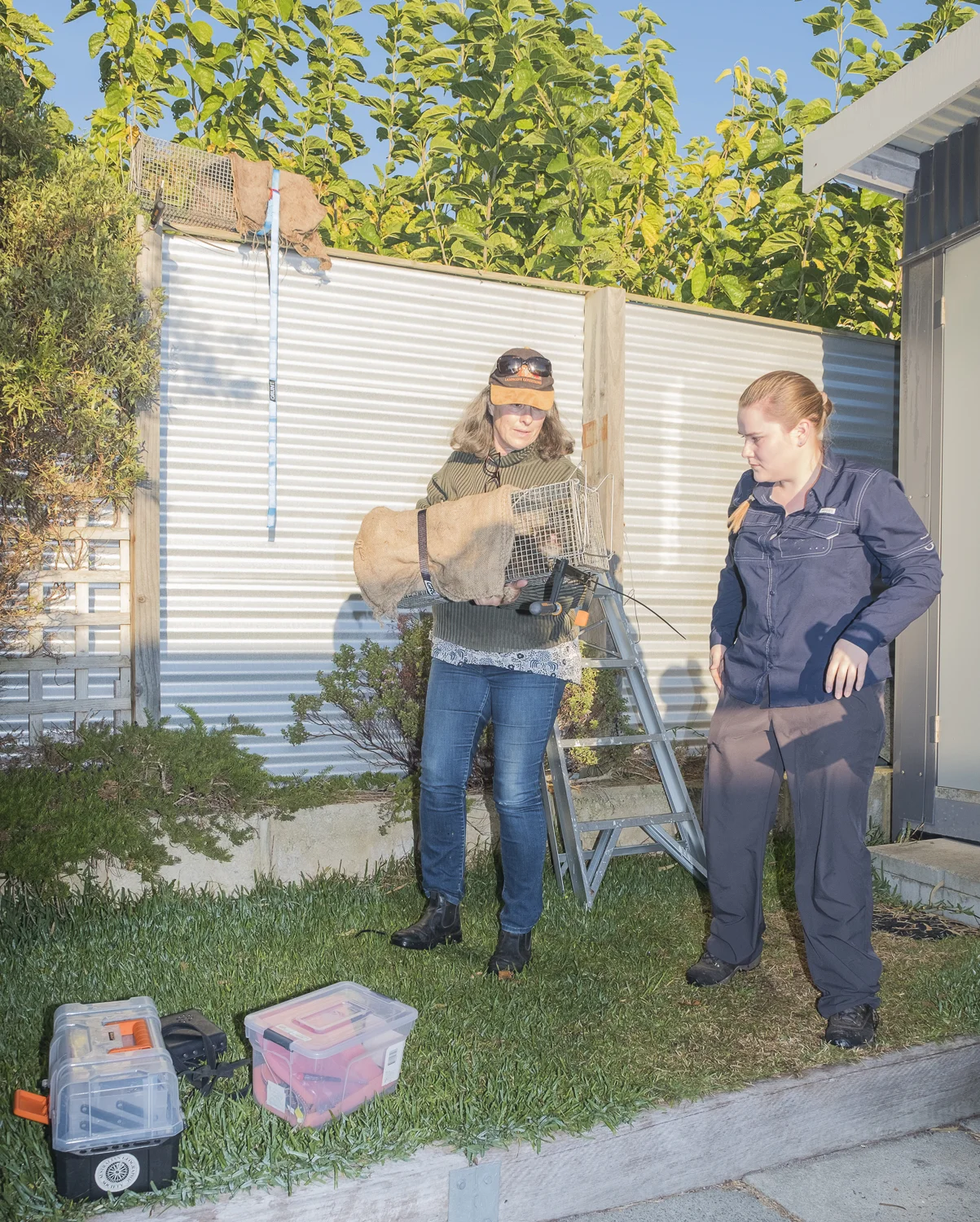 Sarah Comer, DBCA and Bronte Van Helden with the first possum of the day, named Jackie.
