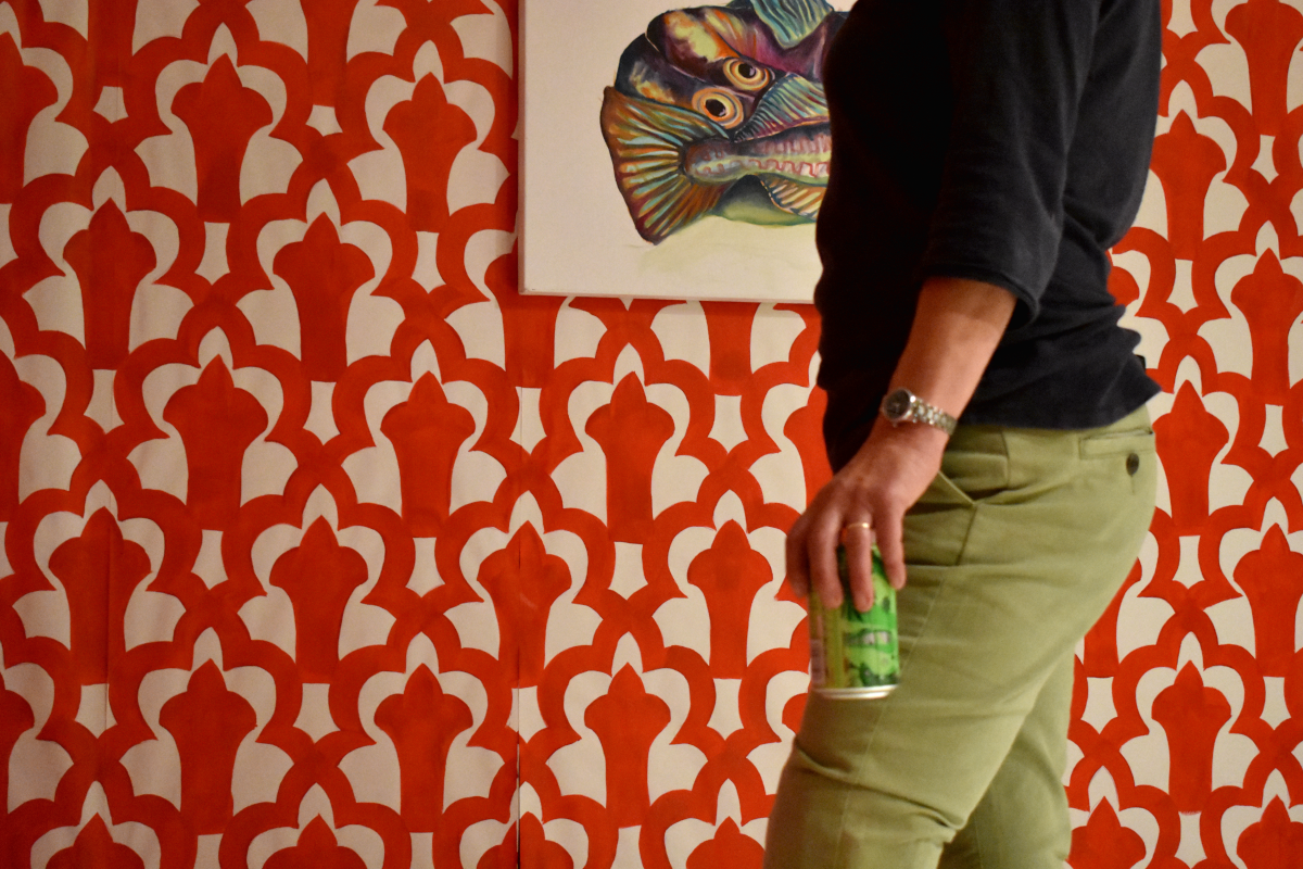 A visitor enjoying a can of American Pale in front of my painting, ‘Fish’