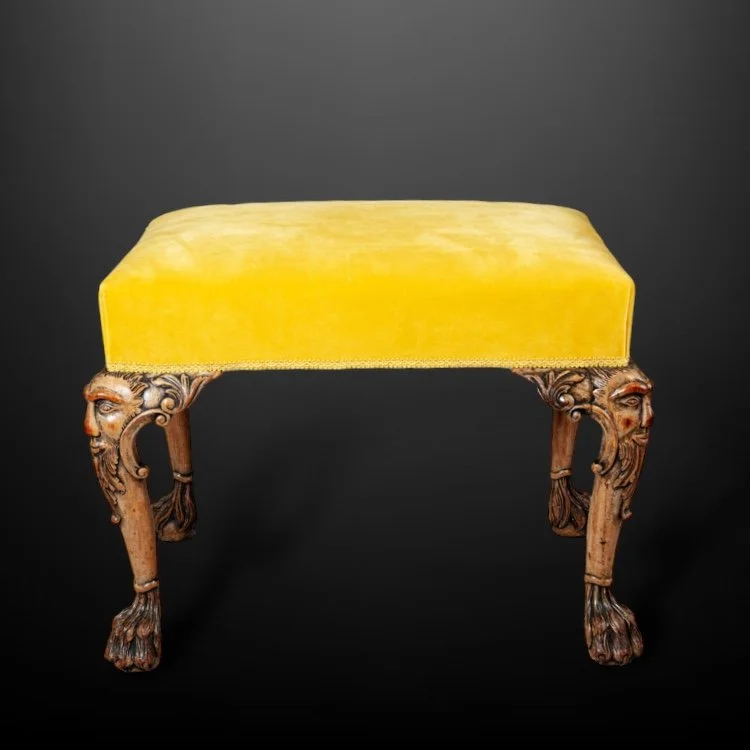 A distinctively carved mahogany stool, 19th Century.JPG
