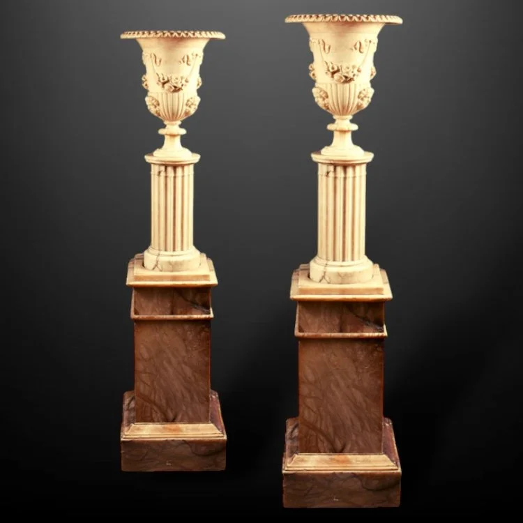 A pair of illuminating classical alabaster columns and vases.JPG