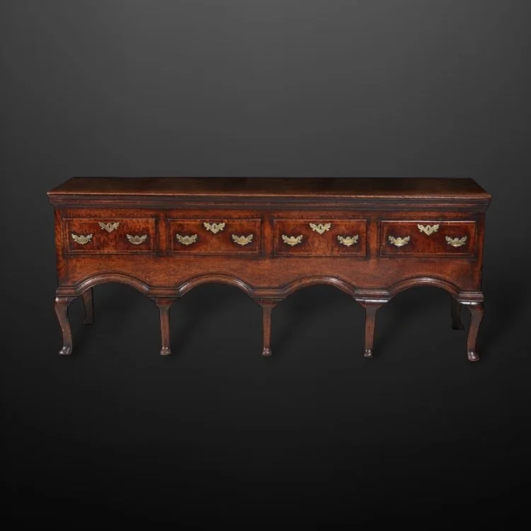 An elegant early 18th Century provincial oak low dresser, English