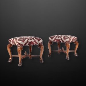 A rare pair of carved walnut stools,  Italy 18th Century