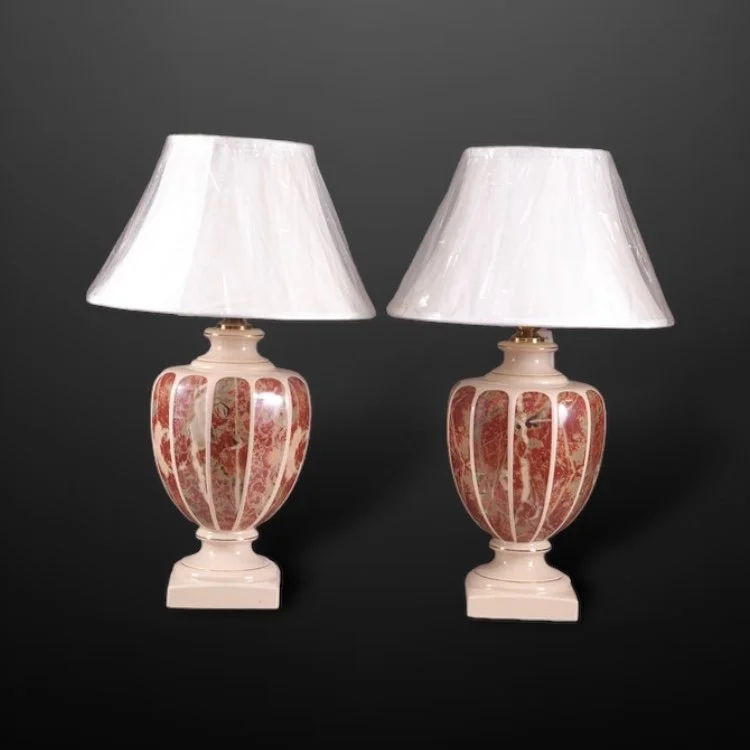 A pair of large urn shaped ceramic table lamps