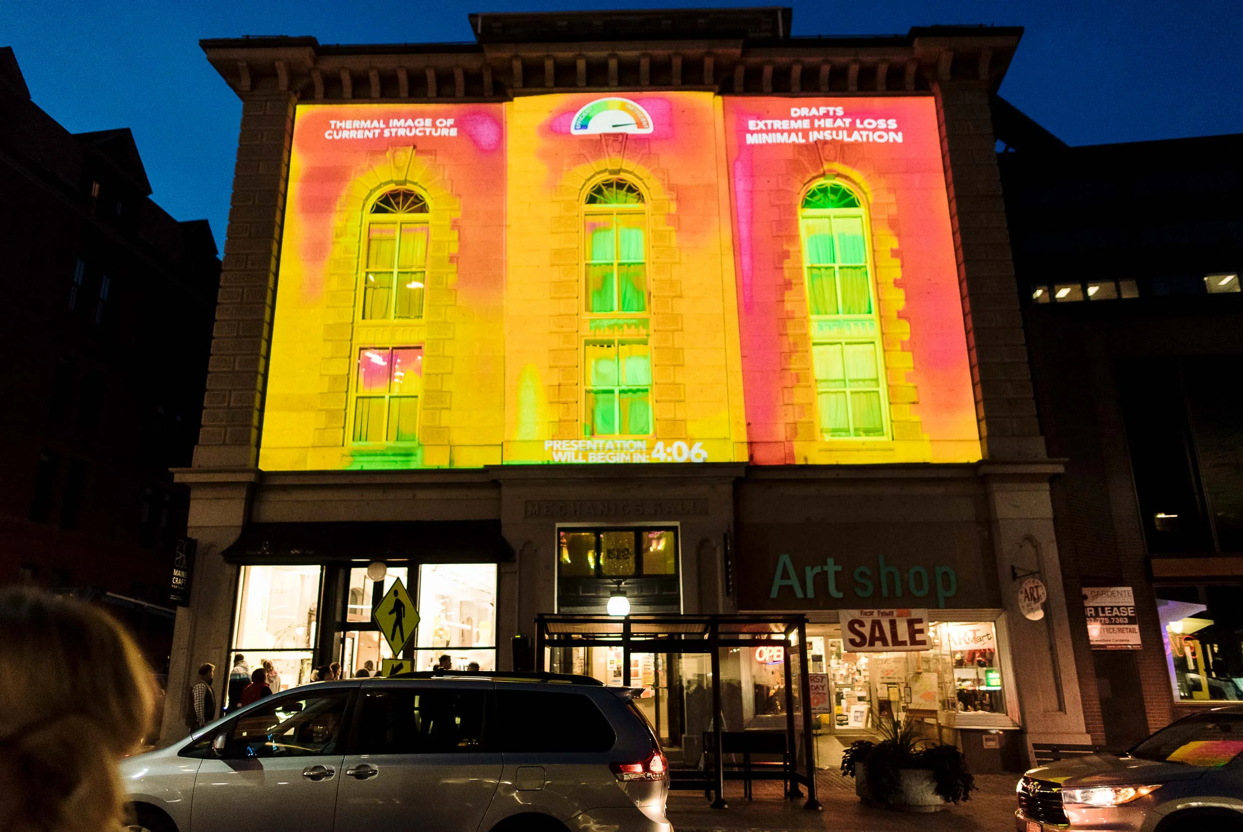The passivhausMAINE event, made possible in cooperation with The VIA Agency, Headlight Audiovisual Inc., and MECA, combined thermographic images, playful animation, and music to create a festive and infor mative display. The thermographic imaging demonstrated the heat loss experienced by Mechanics’ Hall.