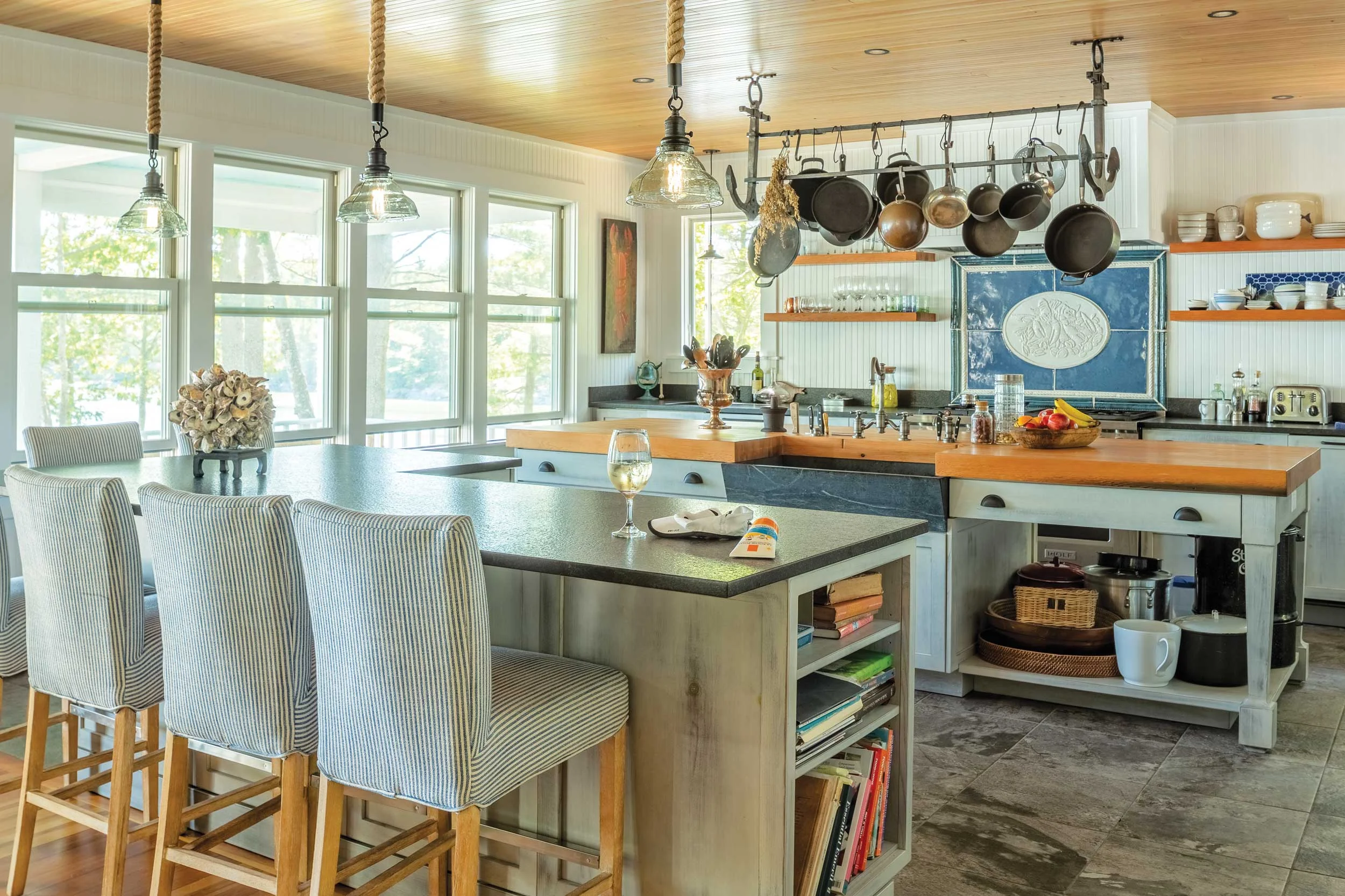 Nancy wanted a backsplash that depicted the iconic Maine lobster feast. This custom-made tile illustrates a platter of lobsters, clams, mussels, and corn.