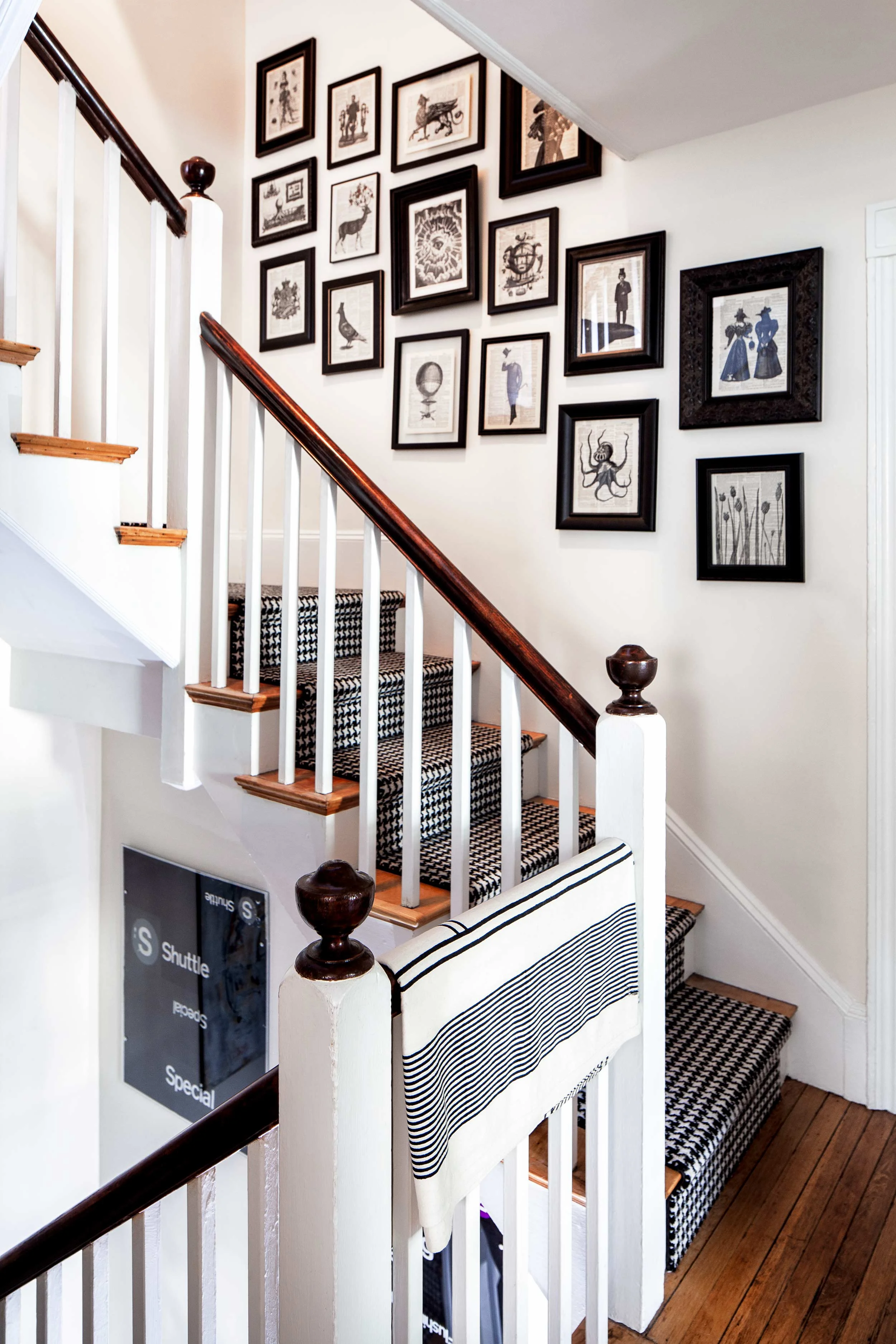 Montanaro and Saiber found frames in antique stores for the hand-stamped collages made from vintage dictionary pages that line the stair well between the second and third floors.