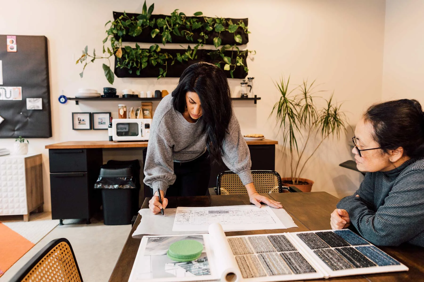 Zoulamis works on a project with Bowerbird’s draftsperson, Judith Bernier.