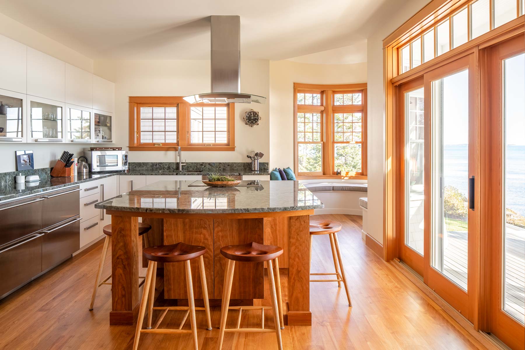 Broad windows and a perfected balance of whites and natural wood help the doctors “keep it light on the inside.”