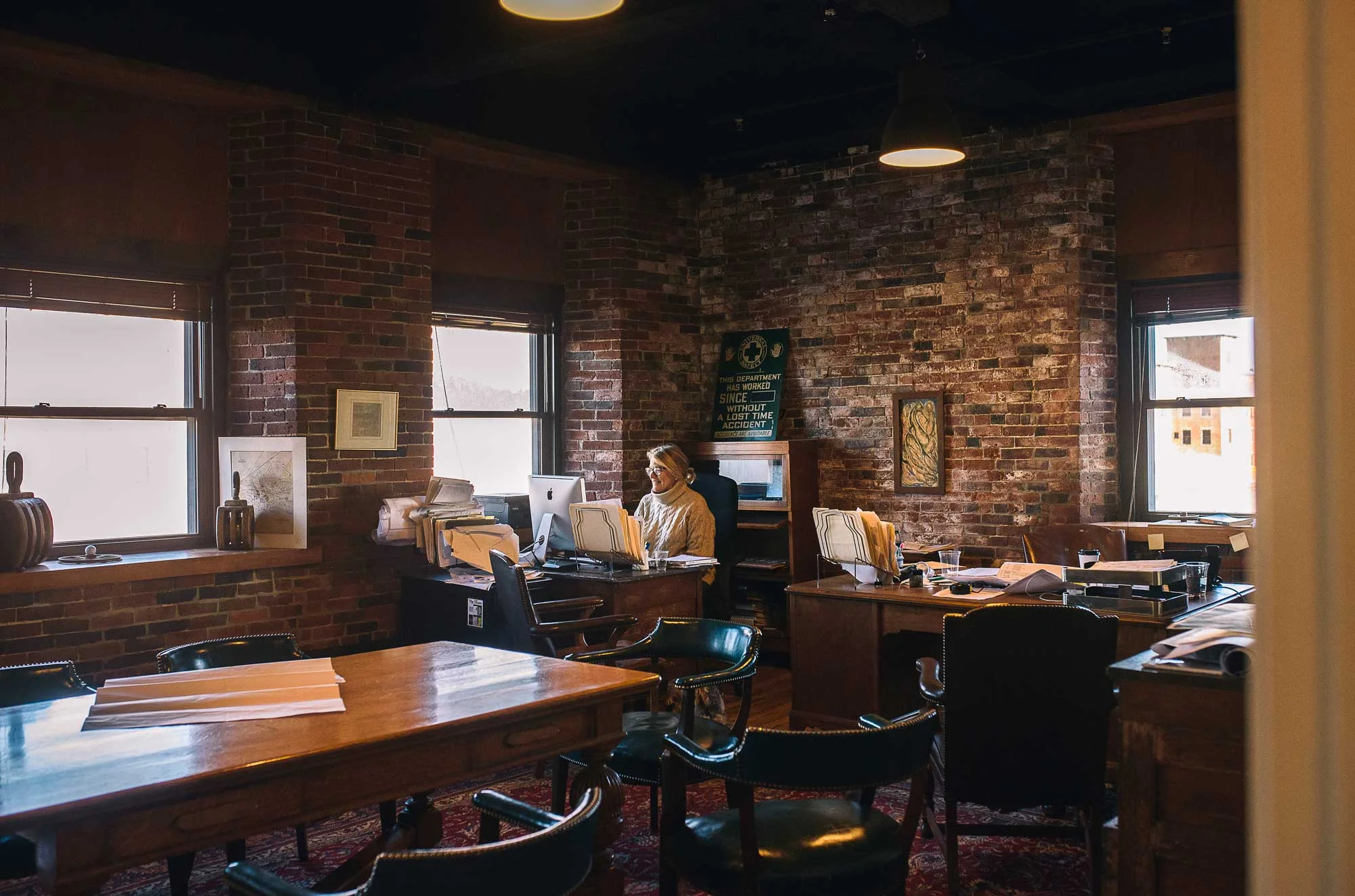 Lauren Cullity-Sanford, business partner and co-owner of the Pepperell Mill Campus, takes a call in the mill headquarters.
