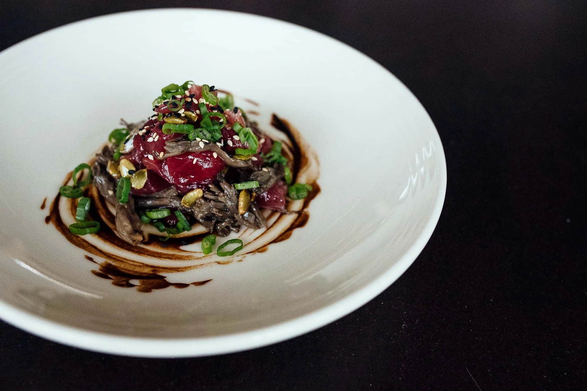 Maitake mushroom confit gives a perfect balance of texture and earthiness to the pristine tuna tartare.